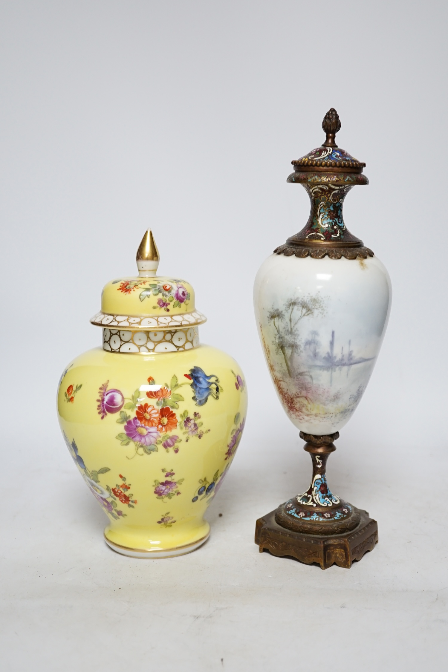 A 19th century French ormolu, enamel and porcelain urn and cover and a Dresden yellow urn and cover, tallest 31cm